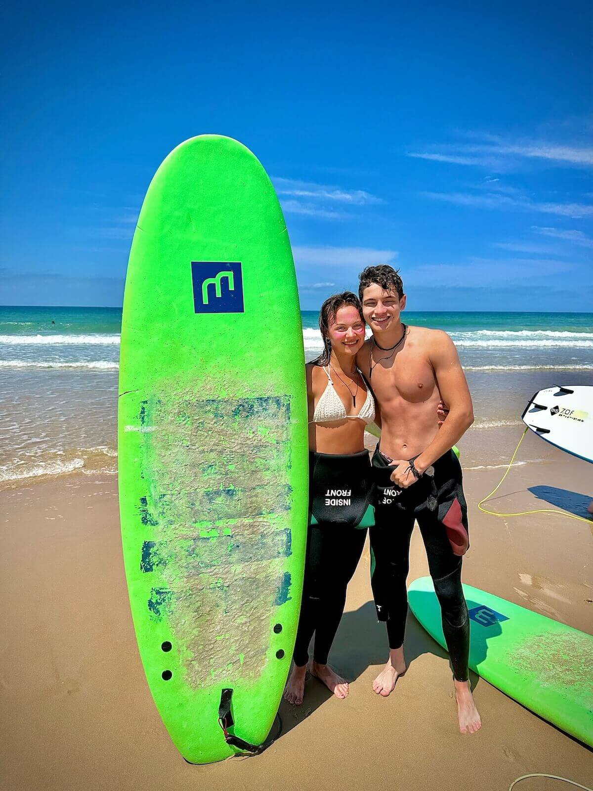Learning to surf on our Spanish beaches with our summer program