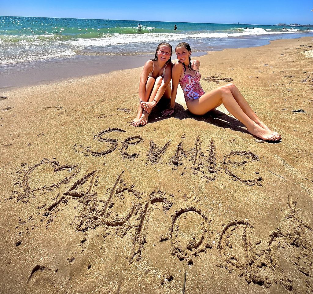 Students enjoying beach day during high school summer program in southern Spain